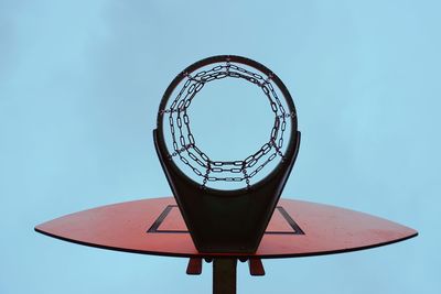 Directly below shot of basketball hoop against sky