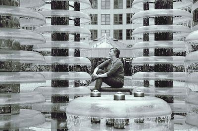 Man sitting in shopping mall