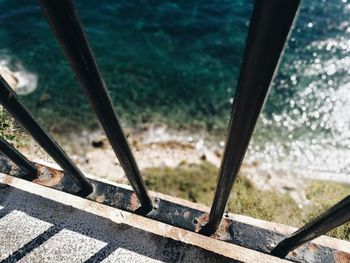 High angle view of railing by river