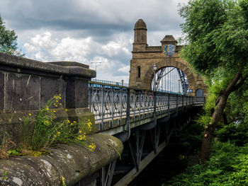 Bridge over river against sky