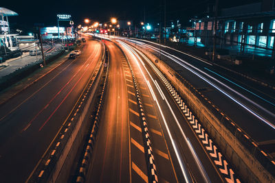 High angle view of light trails on road at night