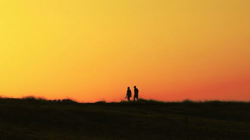 Scenic view of landscape at sunset