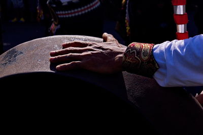 Close-up of hand holding cross