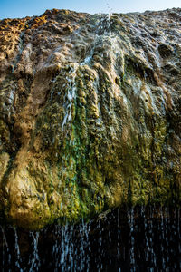 Close-up of rock formation in sea