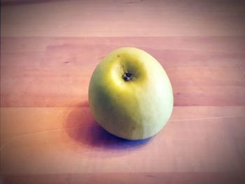 Close-up of apple on wooden table