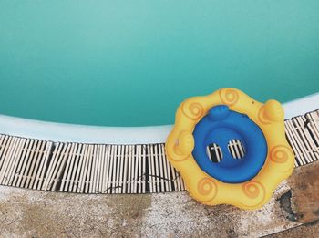 High angle view of inflatable ring on poolside
