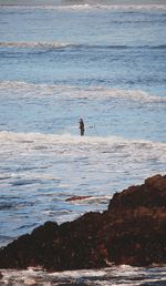 People on beach by sea