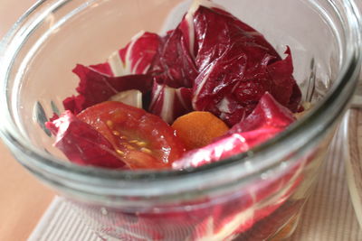 High angle view of fruits in glass jar on table