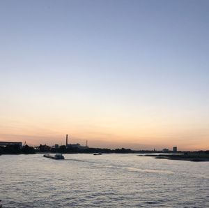 Scenic view of sea against clear sky during sunset