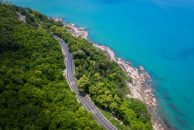 Aerial view of road by sea