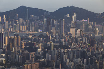 Aerial view of buildings in city against sky