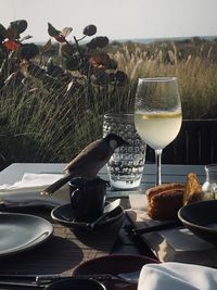 Close-up of wine glasses on table