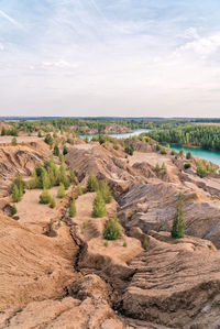 Picturesque landscape of sandy rocks and lake with blue or turquoise clear water.  konduki, russia