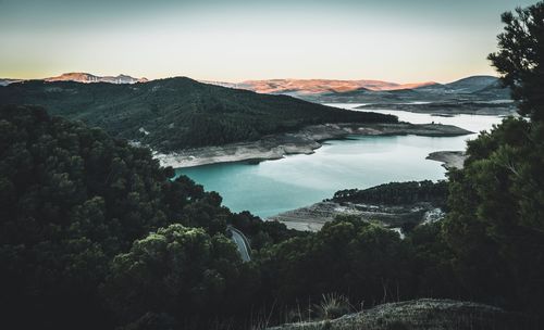 Scenic view of lake and mountains against sky