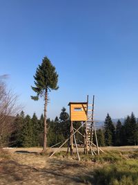 Built structure on field against clear sky