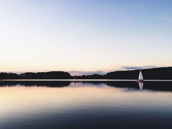 Reflection of trees in calm lake