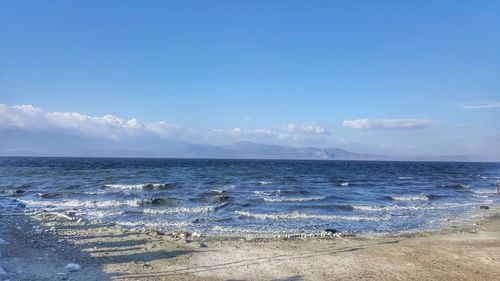 Scenic view of sea against blue sky