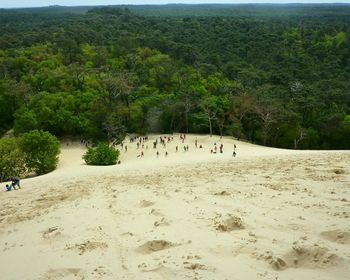 People on beach against sky