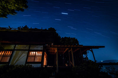 Low angle view of built structure against sky at night