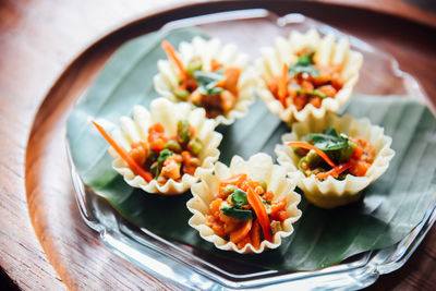 Thai food, kratong thong  minced chicken and sweet corn in crispy golden cup on dish