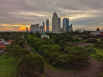 View of buildings against cloudy sky