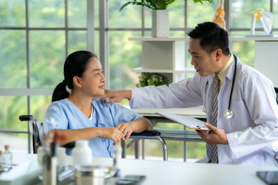 Side view of business colleagues working in office