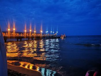 Scenic view of sea against sky at night