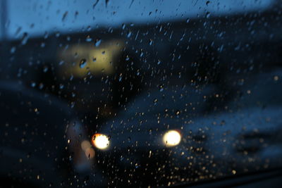 Close-up of wet window in rainy season