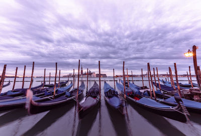 Boats moored at harbor