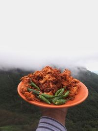 Close-up of hand holding food