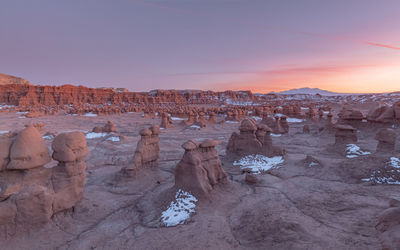 Panoramic view of rock formations on landscape against sky