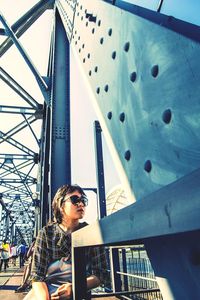 Low angle view of woman looking at camera