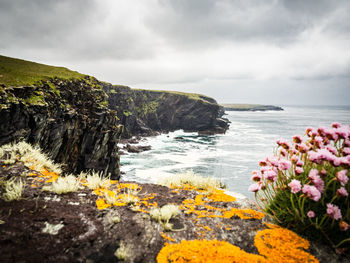 Scenic view of sea against cloudy sky