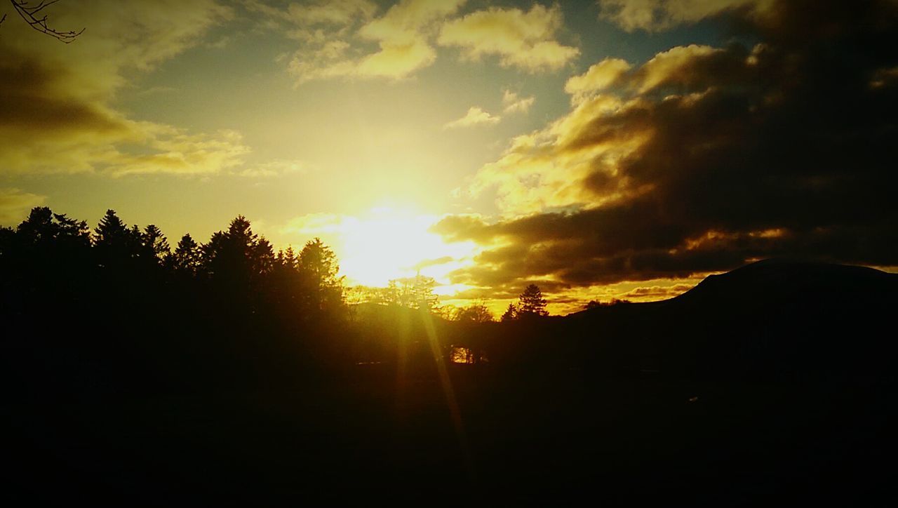 silhouette, sunset, tranquil scene, scenics, tranquility, sky, sun, dark, beauty in nature, outline, nature, outdoors, cloud, mountain, cloud - sky, non-urban scene, majestic, cloudscape, no people, remote, dramatic sky, cloudy