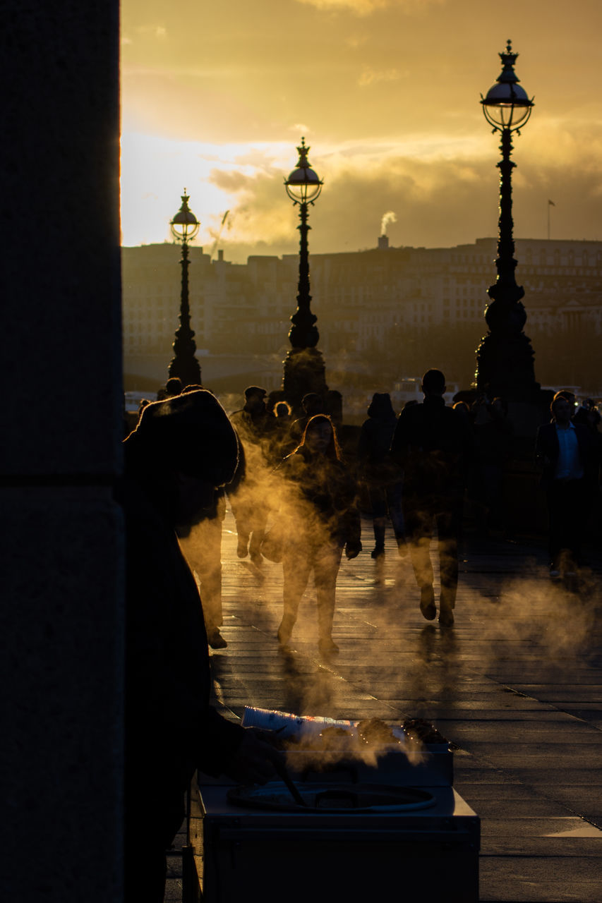 architecture, real people, sunset, built structure, sky, travel destinations, lifestyles, leisure activity, nature, men, city, people, building exterior, travel, tourism, history, the past, outdoors, water, women