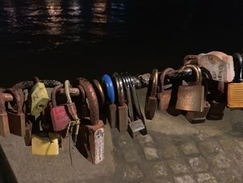 Close-up of padlocks hanging on metal