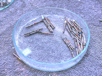 High angle view of metallic objects on table