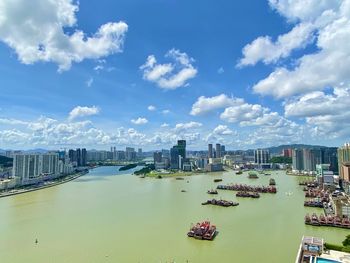 High angle view of city and buildings against sky