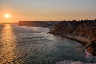 Scenic view of sea against clear sky during sunset