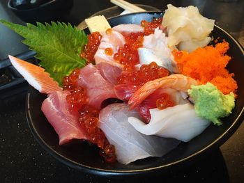 High angle view of red caviar in plate on table