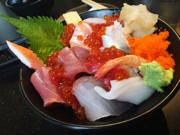 High angle view of red caviar in plate on table