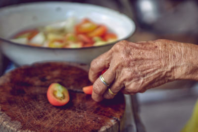 Midsection of man preparing food