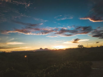 Scenic view of silhouette landscape against sky during sunset