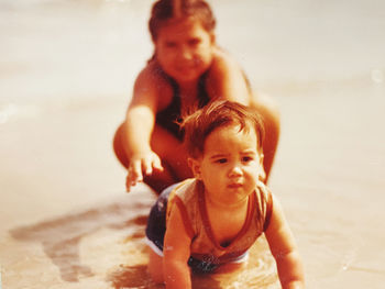 Portrait of mother and son on beach