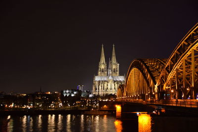 Bridge over river at night