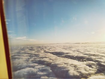 Scenic view of cloudscape seen through airplane window