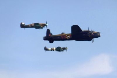 Low angle view of airplane against clear sky