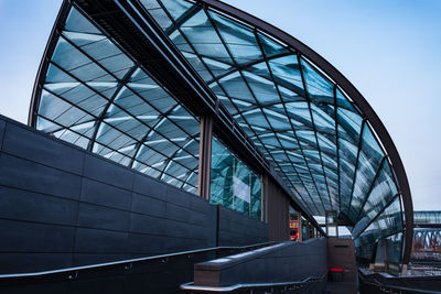 Low angle view of modern bridge against sky