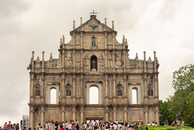 Group of people in front of historic building