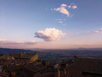 Aerial view of cityscape against sky during sunset